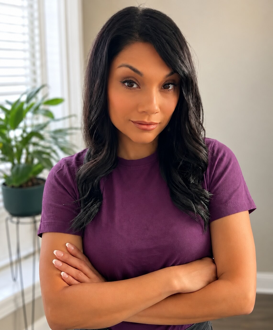 Julie Jae, founder of Julie Jae Works Studio, wearing a plum top.
