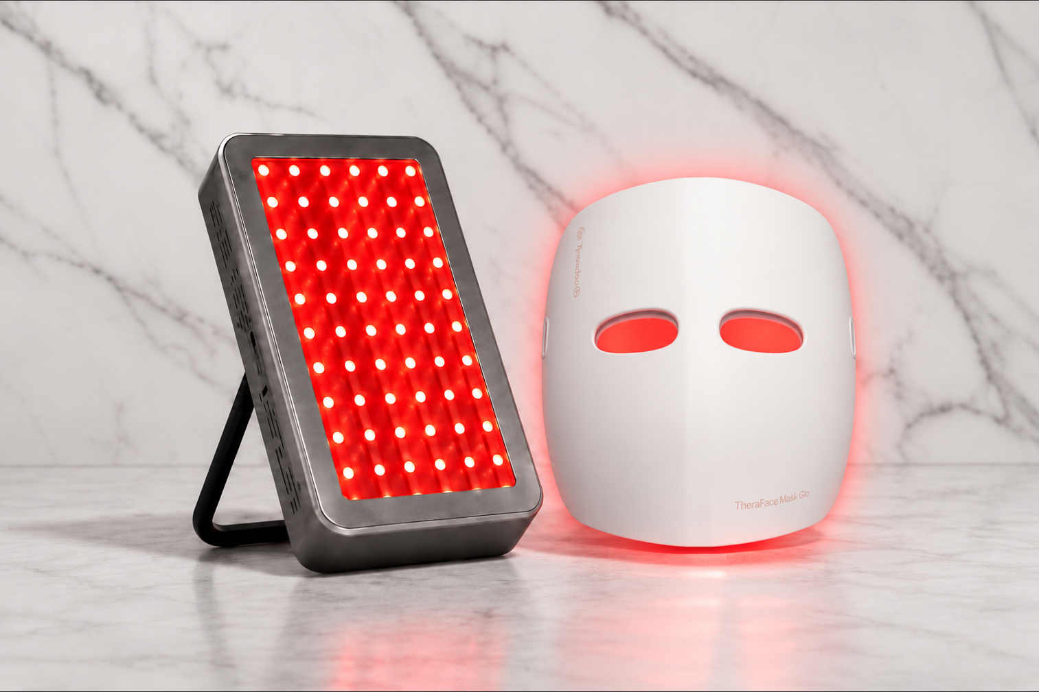 TheraFace Mask Glo beside a compact red-light therapy panel.